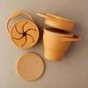 Foldable Silicone Snack Cup In Golden Ochre -LITTLE Baby Gear little little chew foldable silicone snack cup in golden ochre 49423283749156