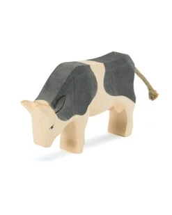 Black + White Cow Eating